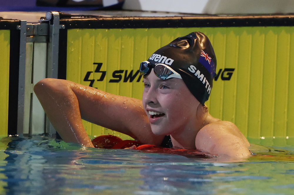 Gaby smiles in the pool at the end of the race