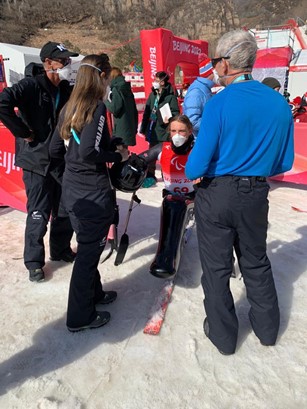 Gracey with Paralympian Aaron Ewen, and other NZ Support Staff