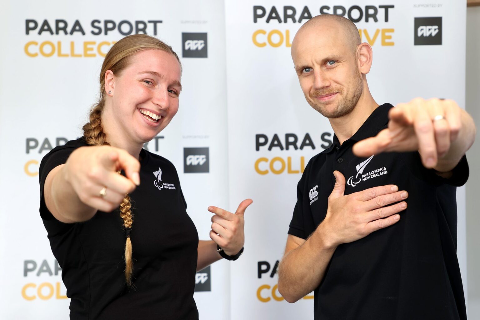 Siobhan Terry and coach Jack Cooper pointing at the camera